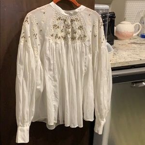 Free people white long sleeved dress with beading.